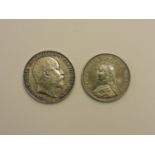 Two silver coins: a Victorian 1887 double florin and an Edward Vll 1902 crown