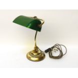 A late 19th century/early 20th century brass bankers lamp, with green glass shade, 40cm tall,