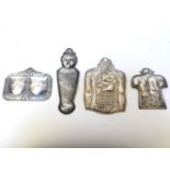 Four late 19th century possibly Mexican white metal ex-votos, in the forms of a baby, a torso with