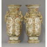 A pair of Kyoto 'Satsuma' Vases, c.1870, each elongated cylindrical body with panels separated by