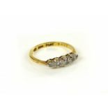 A gold five stone diamond ring, marked 18ct and plat, 2.6g