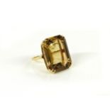 A gold emerald cut smokey quartz ring, marked 14k