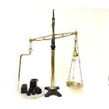 A Victorian cast iron and polished brass set of balance scales, with a pottery dish, labelled '