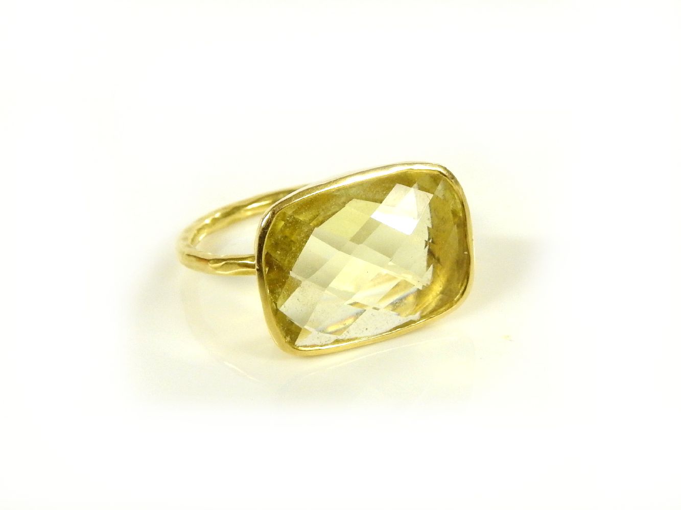 A gold hammered chequer citrine ring, tested as approximately 18ct gold