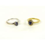 An 18ct gold sapphire and diamond cluster ring, and a white gold single stone tanzanite ring, marked