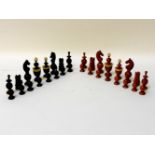 A large 19th century stained chess set, with ivory mounts