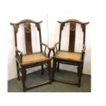 A pair of Chinese hardwood armchairs