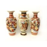 A pair of large Satsuma vases, and a single Satsuma vase, all c1910, loosely painted with figures,