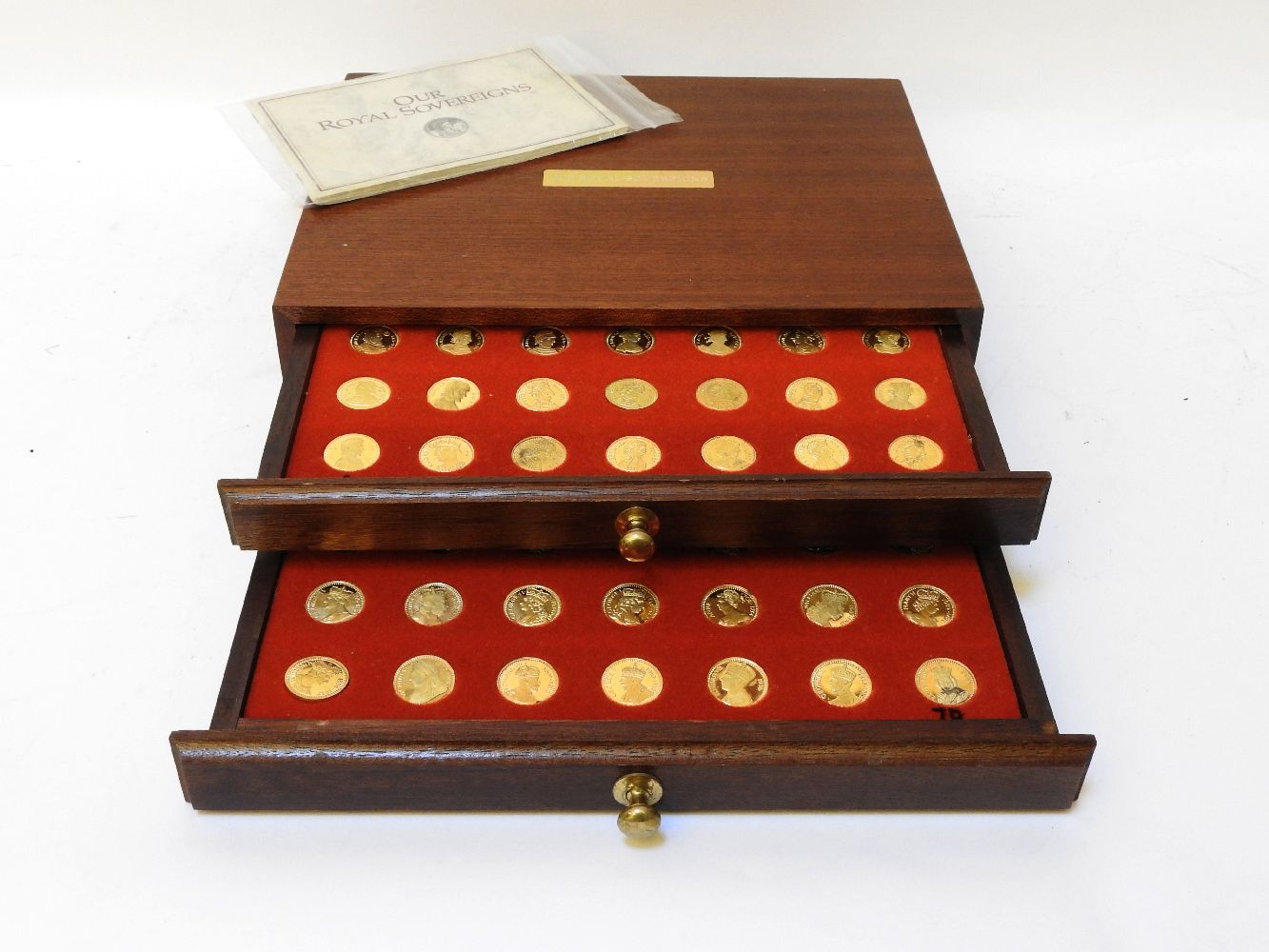 Our Royal Sovereigns collection of gilt coins by Danbury Mint, seventy coins in a fitted case