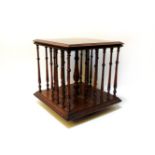 An Edwardian square oak table top revolving book stand, 33cm high