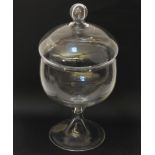 A large glass punch bowl and cover, on circular spreading foot