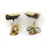 A brass art nouveau brass bankers light, together with a further similar brass lamp (2)