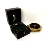 An Alba piccolo record player and records