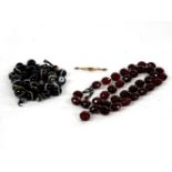 Loose graduated banded agate beads, concealed bead clasp, gold tongue, a rolled gold pink paste