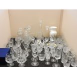 A large quantity of cut crystal glassware, to include decanters, together with a small quantity of