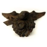 A Black Forest style carved wood eagle and serpent figure