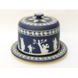 A 19th century Wedgwood Jasperware cheese dome decorated with classical figures, marked to the