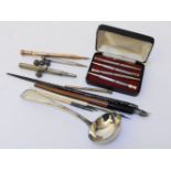 A 19th century gold propelling pencil marked T Butler & Co, further silver pencils, pens, a cased