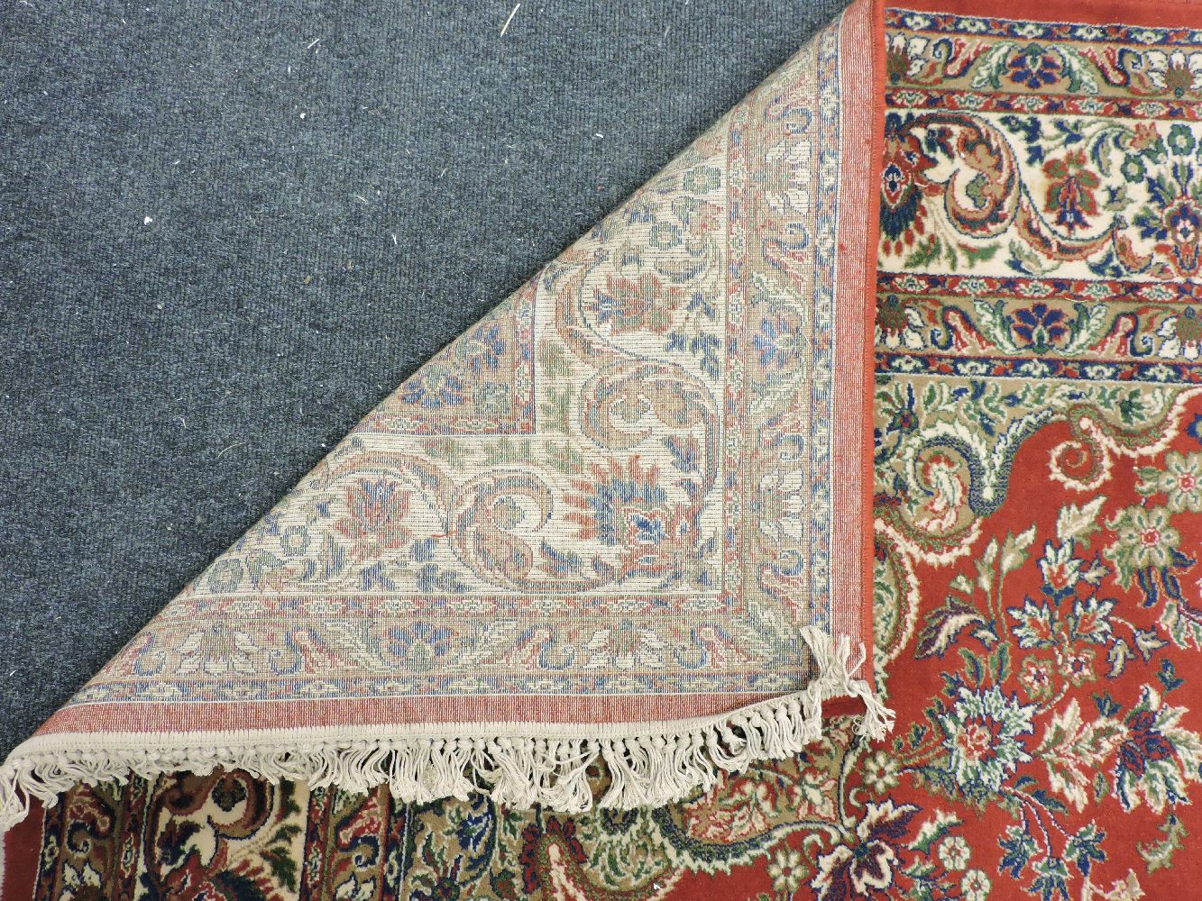 A large red ground Keshan rug, with central foliate medallion within a multiple banded boarder, - Image 2 of 3