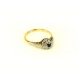 An 18ct gold sapphire and diamond cluster ring