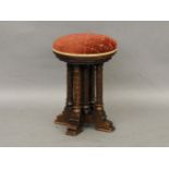 An oak revolving piano/dressing stool, in the gothic manner