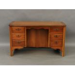 A reproduction mahogany desk, fitted six drawers, 129 x 61 x 75cm