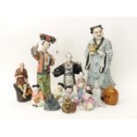 Oriental ceramic figures, all diamond and a large brown glass snuff bottle