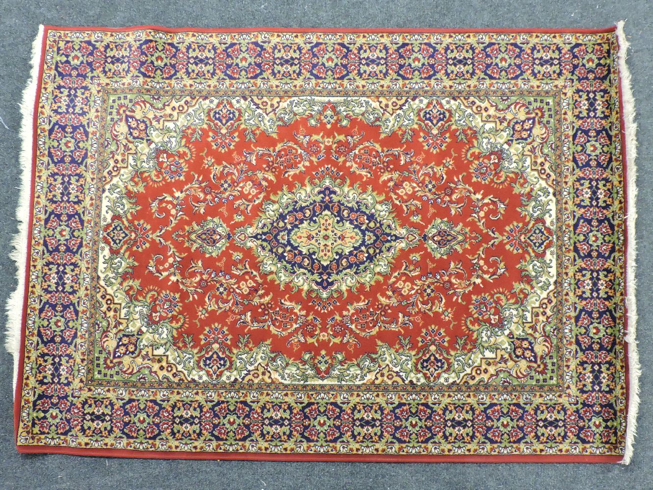 A large red ground Keshan rug, with central foliate medallion within a multiple banded boarder, - Image 3 of 3