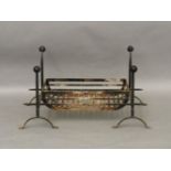 An iron fire basket, with ball finials, 93cm wide