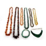 Three single rows of graduating free form amber beads, an amber bead necklace, a single row of
