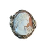 A Victorian gold mounted shell cameo brooch, tested as approximately 9ct gold, with hair locket to