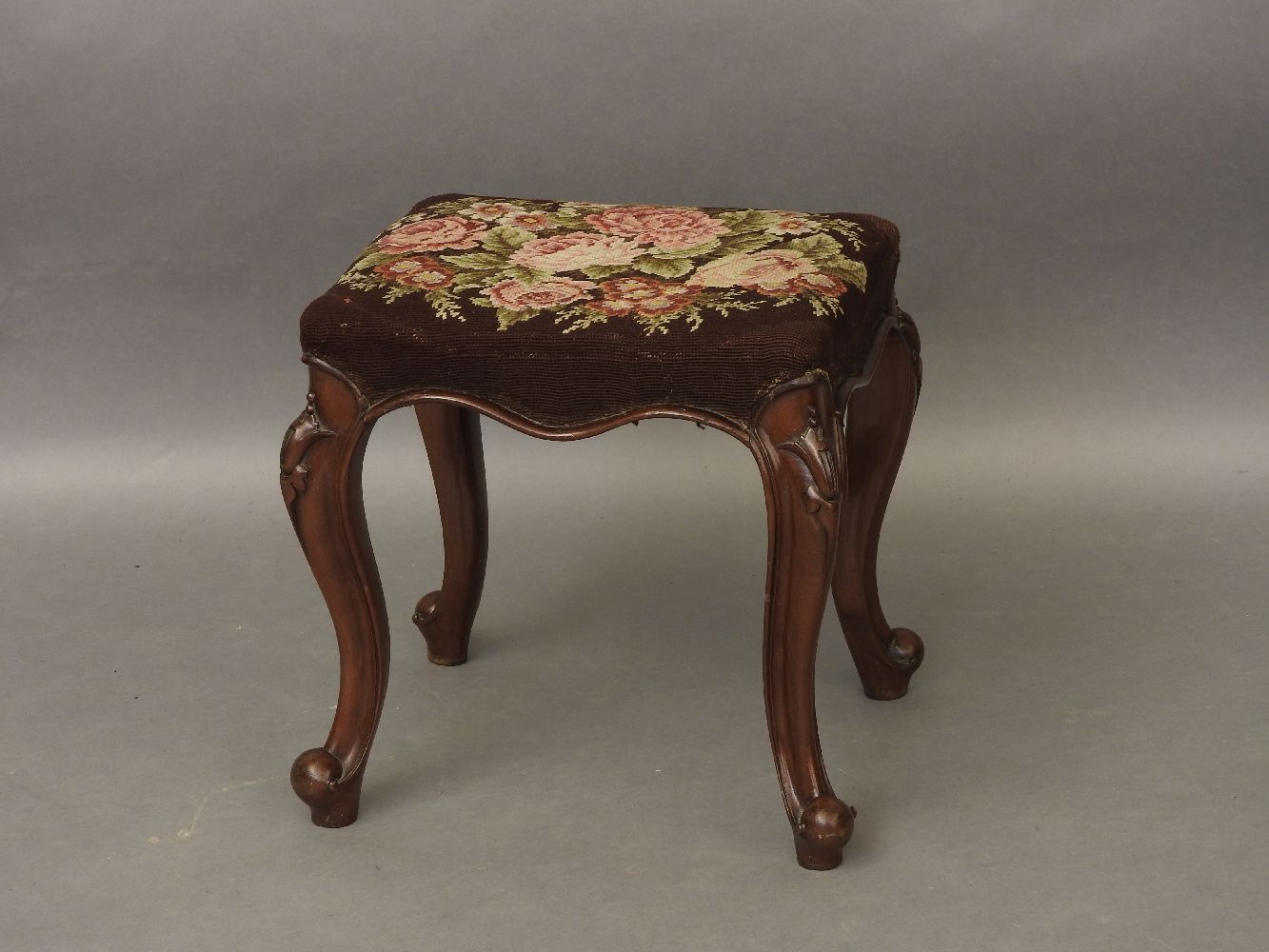 A 19th century mahogany stool, with cabriole legs