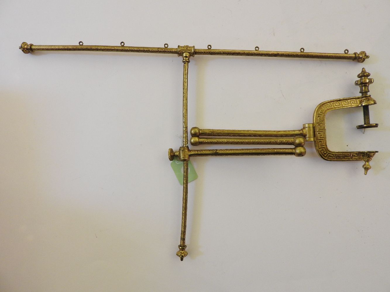 A 19th century gilt metal adjustable fire screen frame