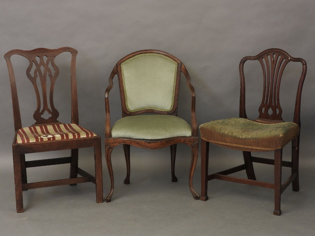 A George III Hepplewhite design side chair, one other Chippendale design, and an open armchair