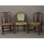 A George III Hepplewhite design side chair, one other Chippendale design, and an open armchair