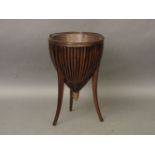 An Edwardian mahogany jardinière