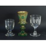 An Austrian green glass goblet, and two drinking glasses