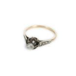 A gold single stone diamond ring, marked 18ct, one claw deficient