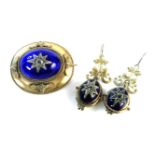 A Victorian gilt metal raised blue guilloche enamel brooch and earring suite, set with a single