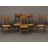 A set of five Arts and Crafts oak and dog tooth inlaid chairs, comprising two armchairs and three