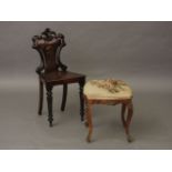 A Victorian mahogany shield back hall chair, and a French cabriole leg stool