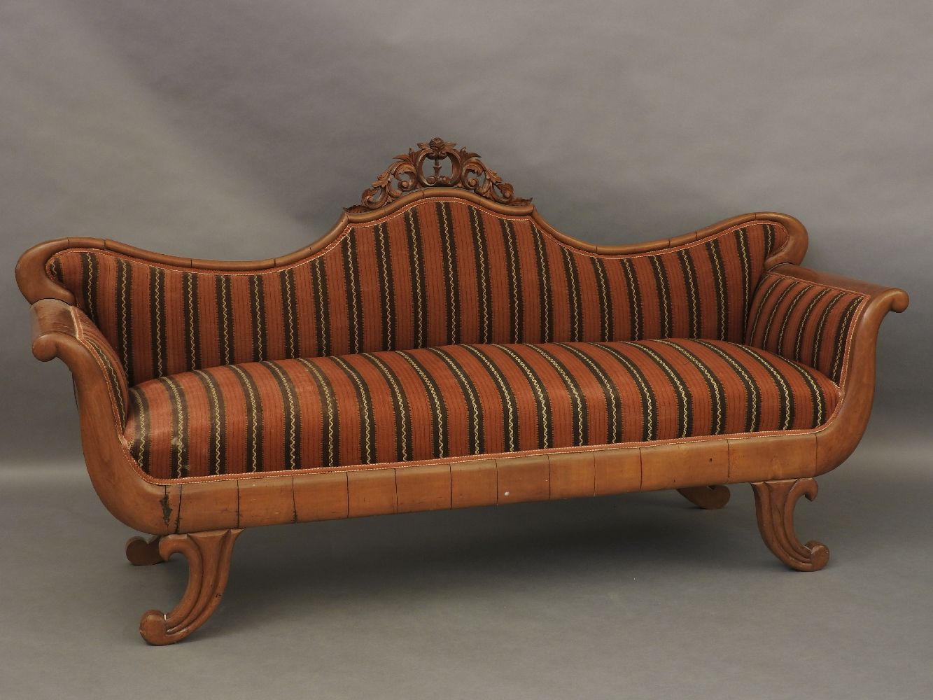 A 19th century mahogany framed scroll ended sofa, 215cm wide