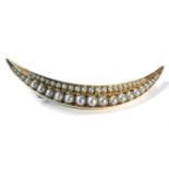 A gold split pearl crescent brooch, tested as approximately 15ct and 9ct, 5.46g