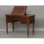 A Victorian mahogany writing table, with a ratchet top writing surface over four drawers, 106.5cm