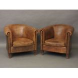 A pair of leather tub chairs, 82cm wide approx