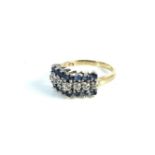 A gold diamond and sapphire three row ring, marked 375, 2.23g