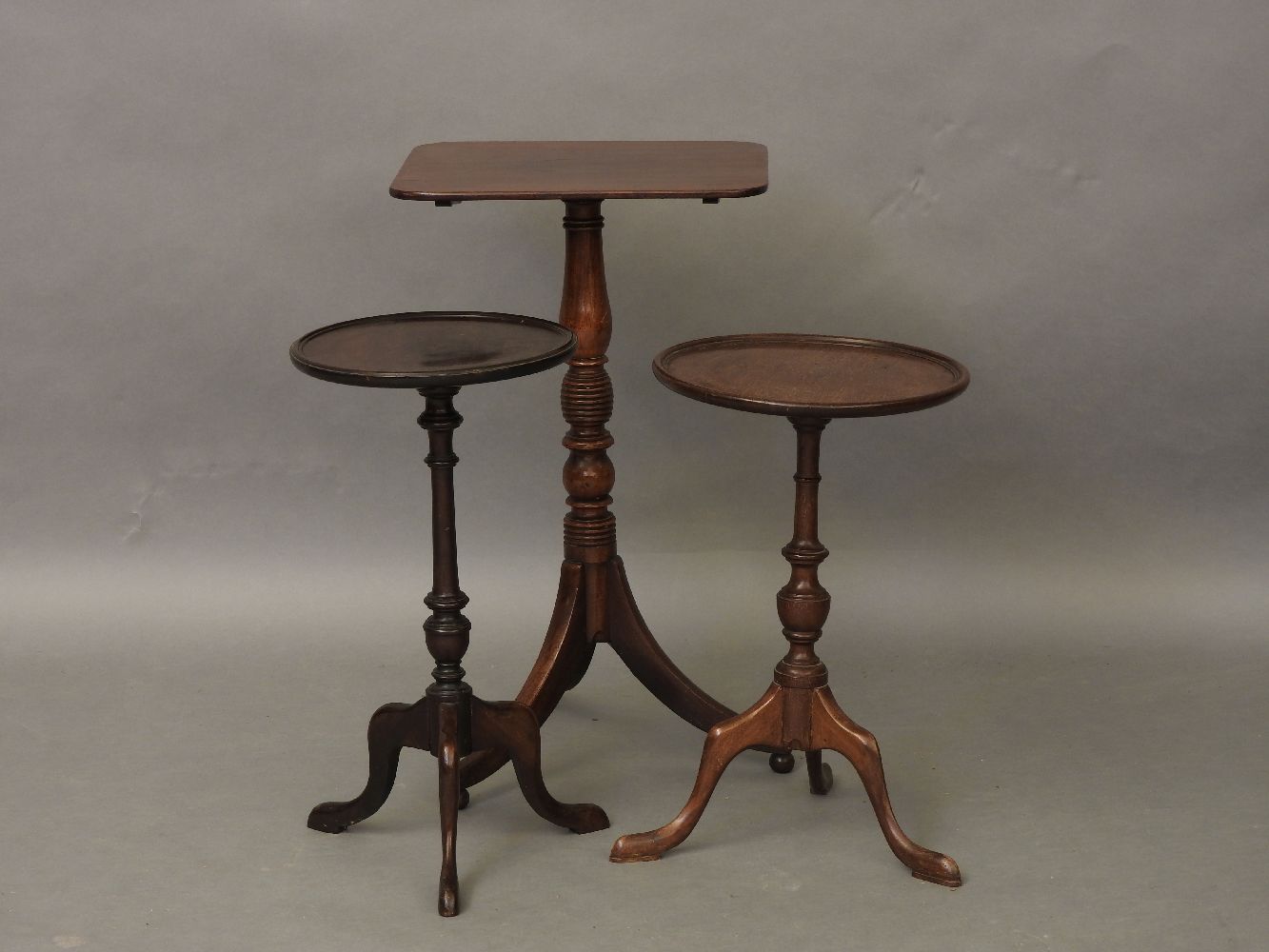 A 19th century tripod table, and two other tripod tables