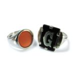 A gold cornelian signet ring marked 9ct, and a gold onyx initial ring, marked 9ct, 8.72g