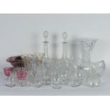 Glassware including custard cups, a pair of decanters, cut glass bowls, etc.