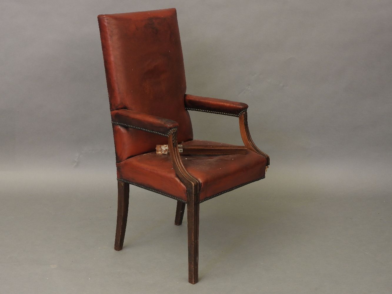 A George III design mahogany high back open armchair upholstered in faux red leather (A.F.)